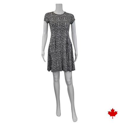 mannequin wearing leopard print swing dress front view on white background