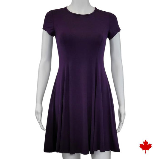 mannequin wearing plum purple swing dress front view on white background
