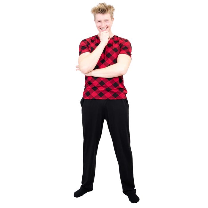 male model wearing black tanner pants and adam top front view on white background
