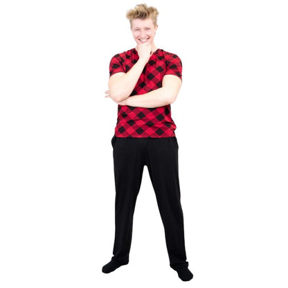 male model wearing black tanner pants and adam top front view on white background