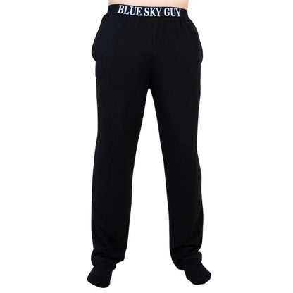 bottom of male model wearing black tanner pants front view on white background