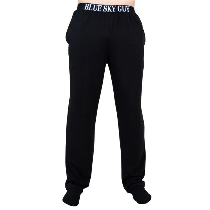 bottom of male model wearing black tanner pants front view on white background