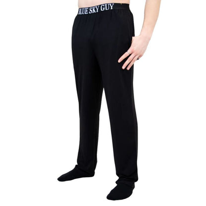 bottom of male model wearing black tanner pants side view on white background