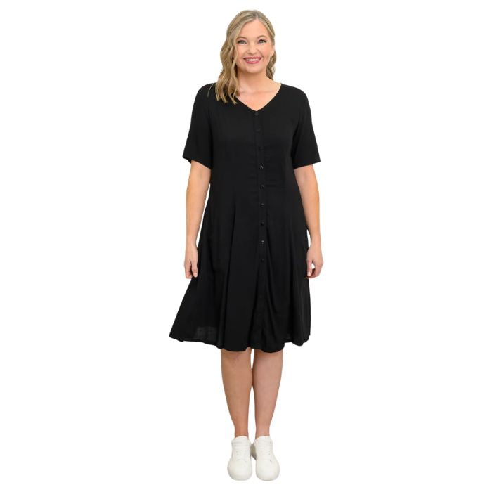 female model wearing black teresa dress front view on white background