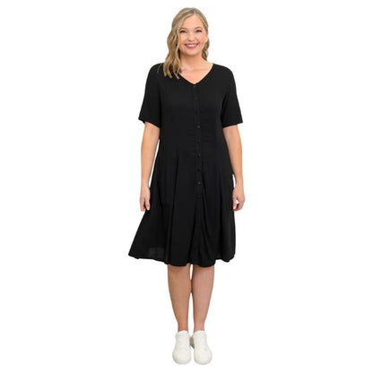 female model wearing black teresa dress front view on white background