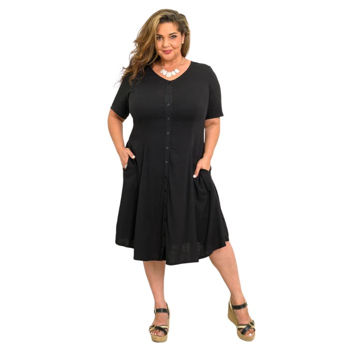 female model wearing black teresa dress front view on white background