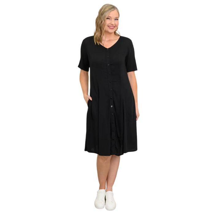 female model wearing black teresa dress front view on white background
