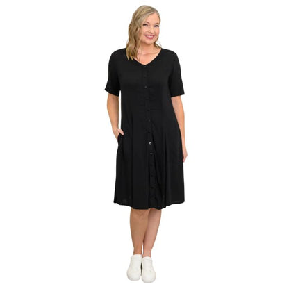 female model wearing black teresa dress front view on white background