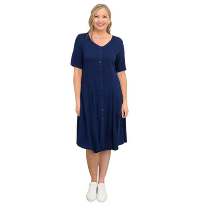 female model wearing indigo blue teresa dress front view on white background