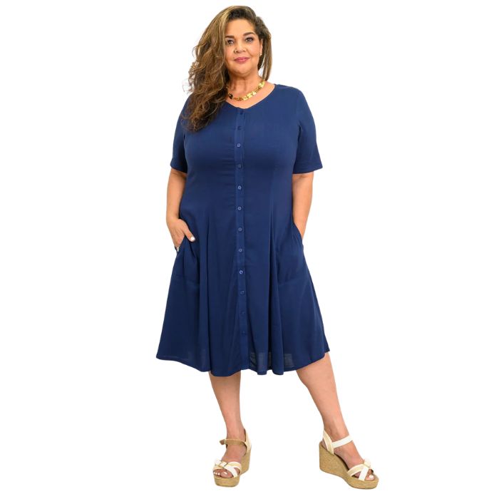 female model wearing indigo blue teresa dress front view on white background