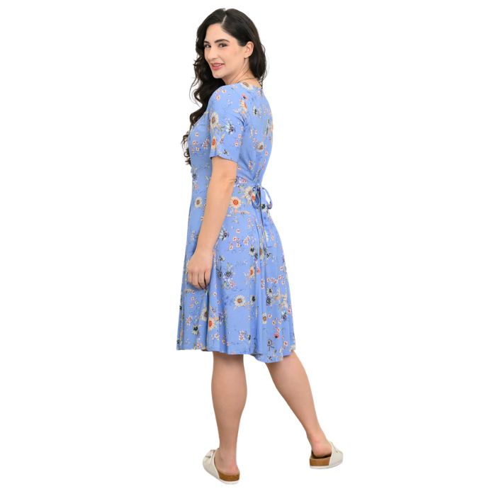 female model wearing peri daisy print teresa dress back view on white background