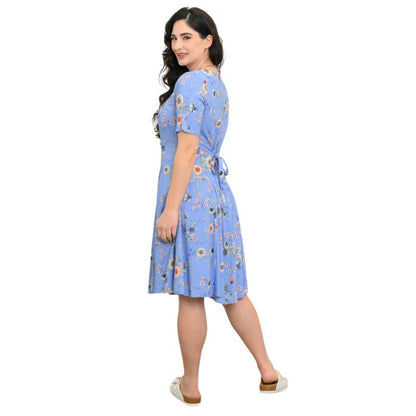 female model wearing peri daisy print teresa dress back view on white background