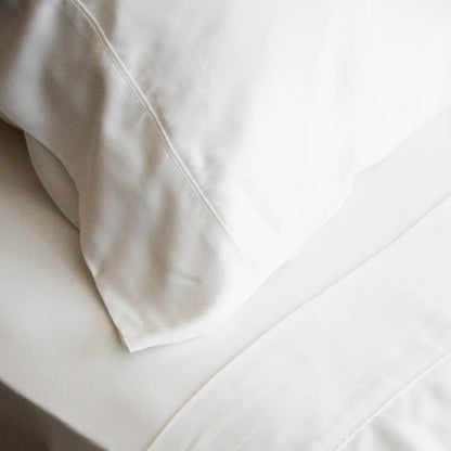 white terrera bamboo pillowcase on a pillow on a made bed