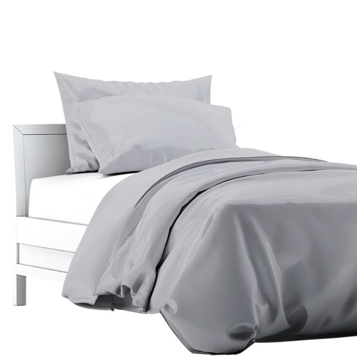 a bed made with grey terrera duvet cover and two pillowcases on white background