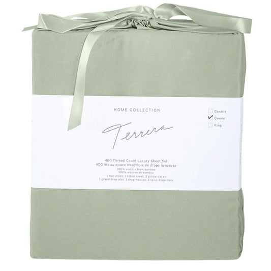 desert sage green bamboo fabric bag with sheet set inside- flat sheet, fitted sheet and two pillowcases on white background