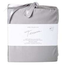 grey bamboo fabric bag containg sheet set- flat sheet, fitted sheet and two pillowcases on white background