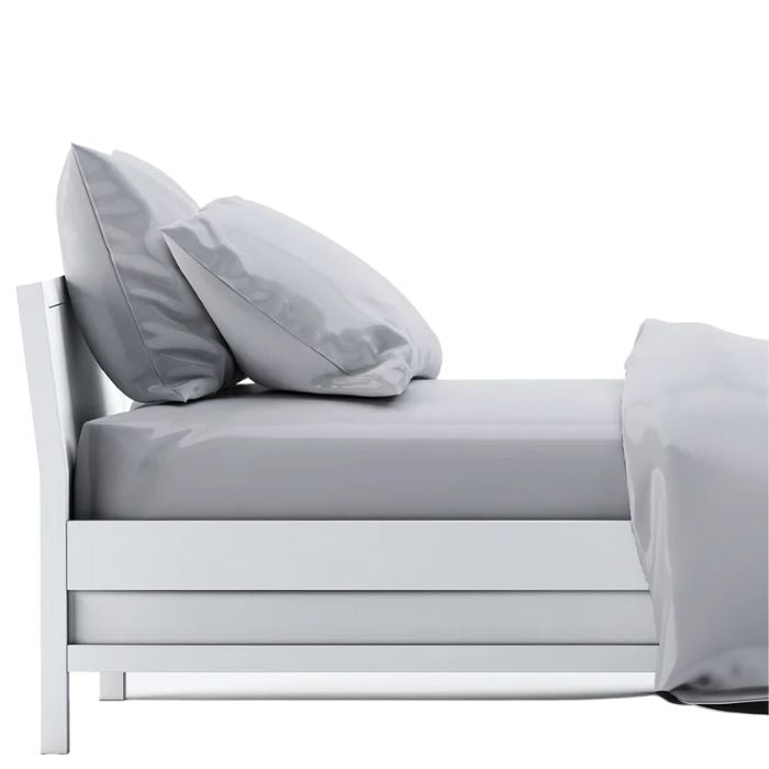 bed made with grey sheet set, flat sheet, fitted sheet and two pillowcases on white background