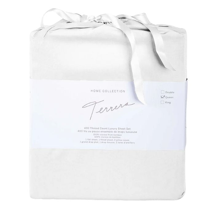 pearl white bamboo fabric bag with sheet set inside- flat sheet, fitted sheet and two pillowcases on white background