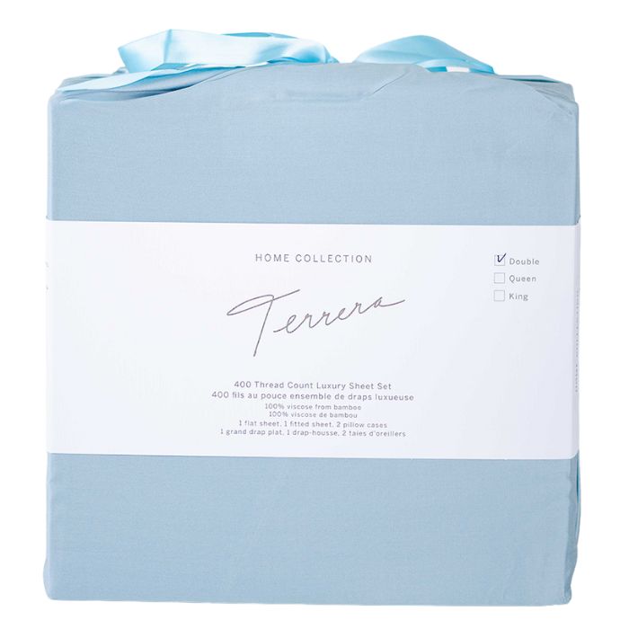 sky blue bamboo fabric bag containg sheet set- flat sheet, fitted sheet and two pillowcases on white background