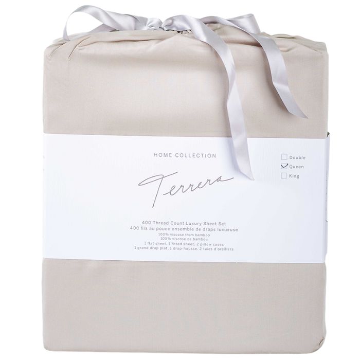 taupe brown bamboo fabric bag containg sheet set- flat sheet, fitted sheet and two pillowcases on white background