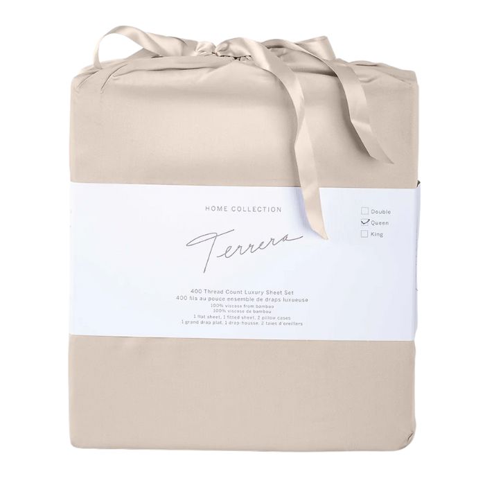 warm taupe brown bamboo fabric bag with sheet set inside- flat sheet, fitted sheet and two pillowcases on white background