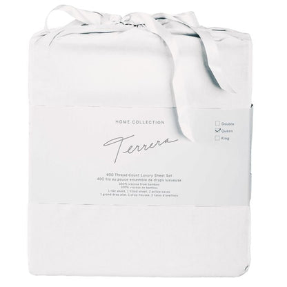 white bamboo fabric bag containg sheet set- flat sheet, fitted sheet and two pillowcases on white background