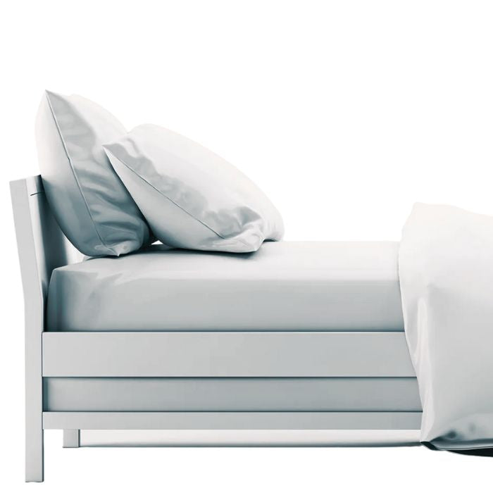 bed made with white sheet set, flat sheet, fitted sheet and two pillowcases on white background