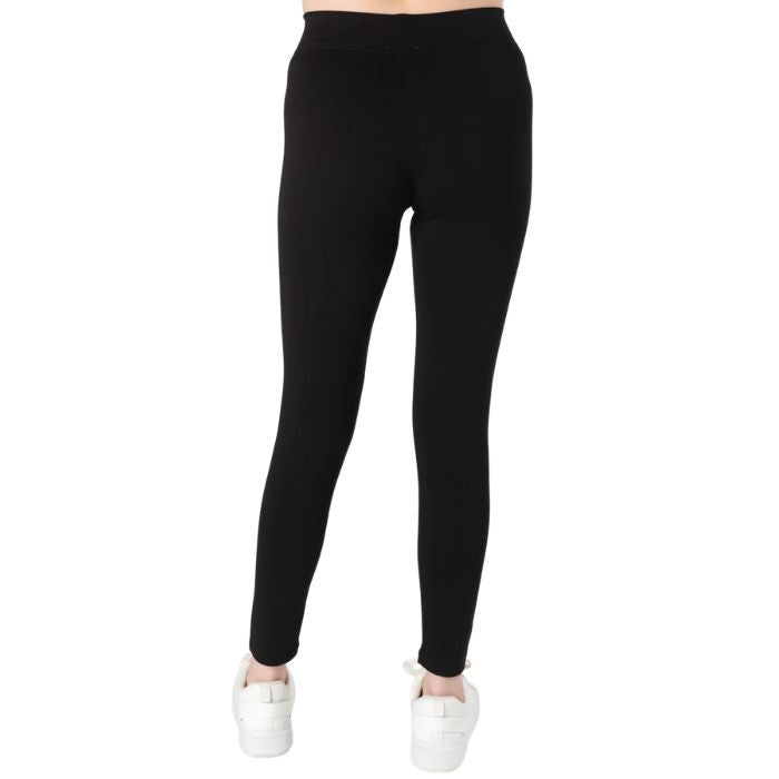 female model wearing black terry leggings back view on white background
