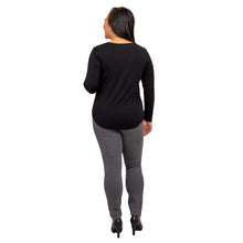 female model wearing tessa long sleeve top black and nadia granite grey pants back view on white background