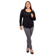 female model wearing tessa long sleeve top black and nadia granite grey pants front view on white background