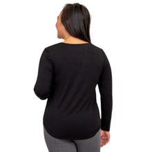 top of female model wearing tessa long sleeve top black back view on white background