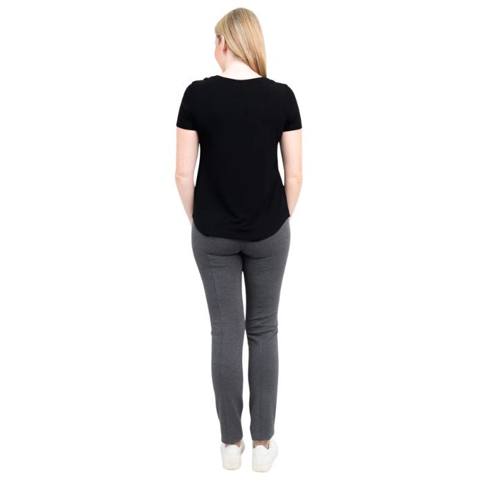 female model wearing black tessa tee and granite grey nadia pants back view on white background 
