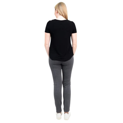 female model wearing black tessa tee and granite grey nadia pants back view on white background 