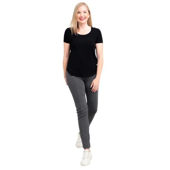female model wearing black tessa tee and granite grey nadia pants front view on white background