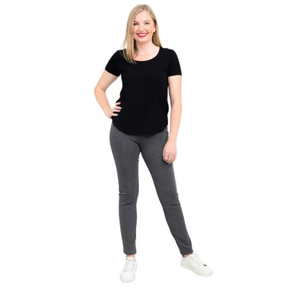 female model wearing black tessa tee and granite grey nadia pants front view on white background 