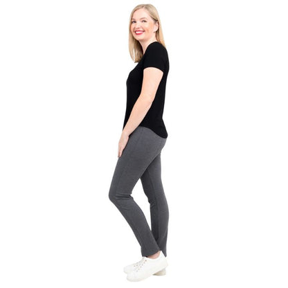 female model wearing black tessa tee and granite grey nadia pants side view on white background