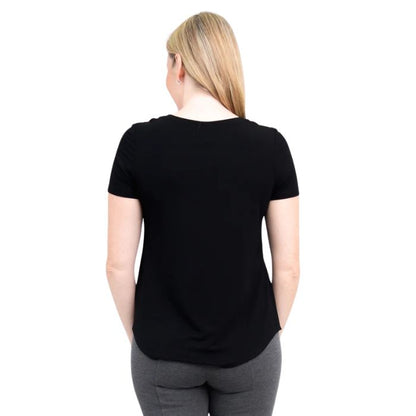 female model wearing black tessa tee back view on white background