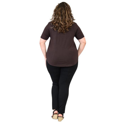 female model wearing coffee brown tessa tee and black nadia pants back view on white background