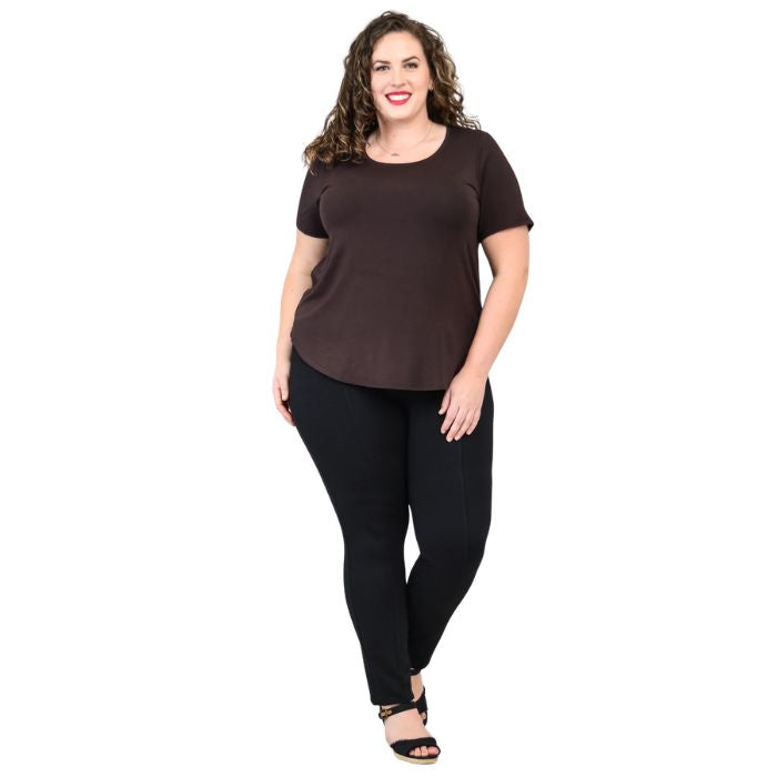 female model wearing coffee brown tessa tee and black nadia pants front view on white background