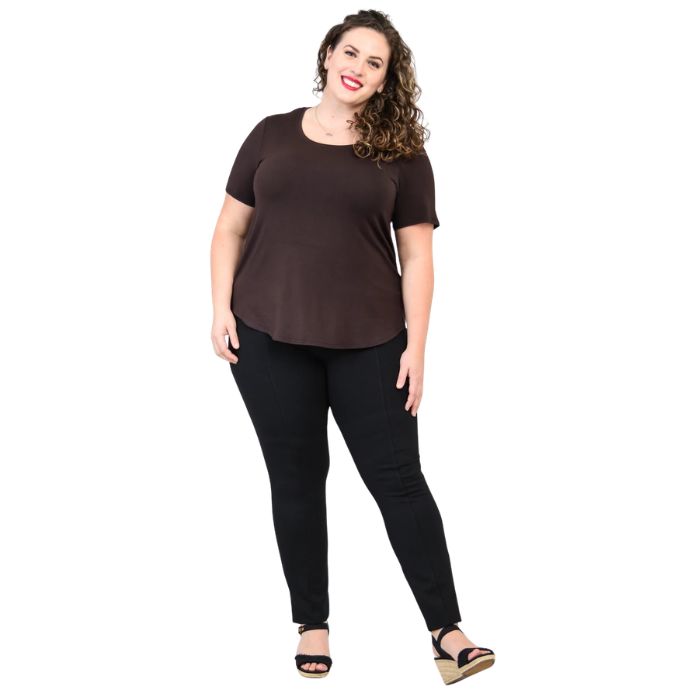 female model wearing coffee brown tessa tee and black nadia pants front view on white background