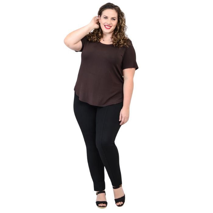 female model wearing coffee brown tessa tee and black nadia pants front view on white background