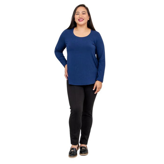female model wearing tessa indigo blue long sleeve to and nadia black pants front view on white background