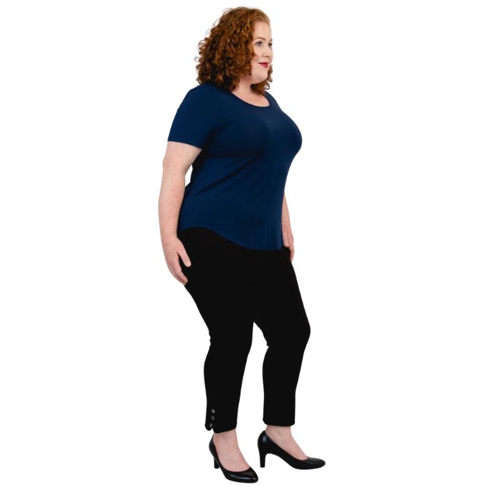 female model wearing indigo blue tessa tee and black nadine cropped pants side view on white background