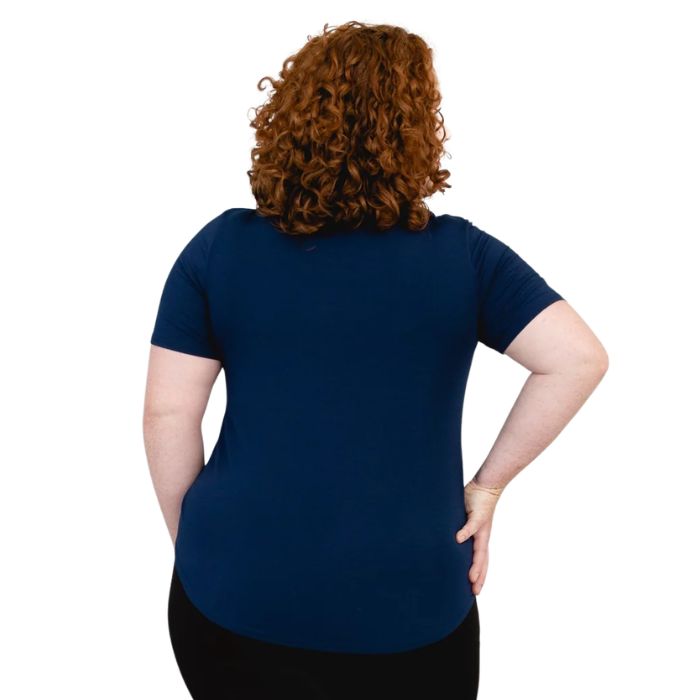 female model wearing indigo blue tessa tee back view on white background