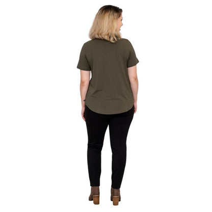 female model wearing khaki green tessa tee and black nadia pants back view on white background