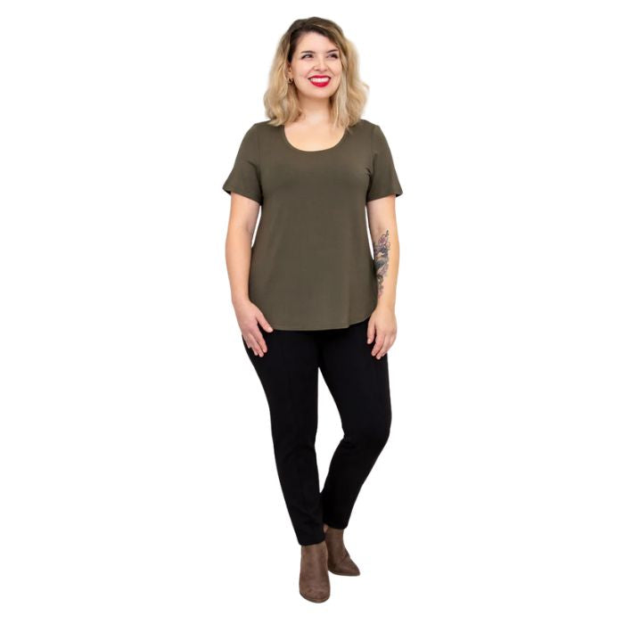 female model wearing khaki green tessa tee and black nadia pants front view on white background