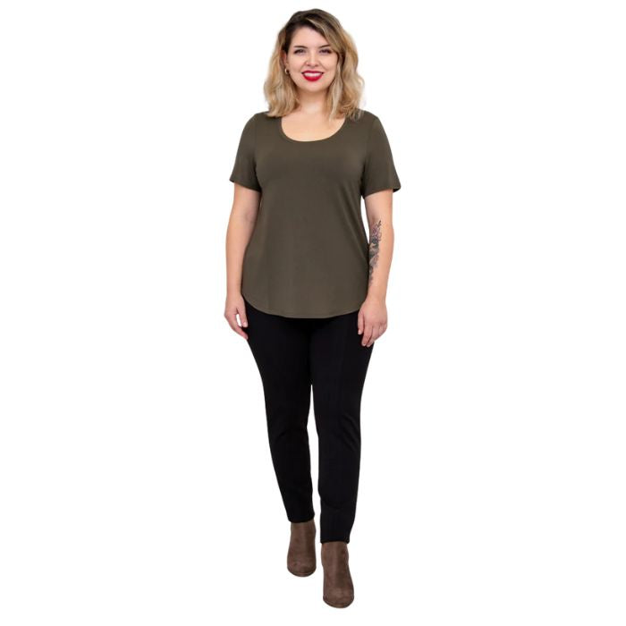 female model wearing khaki green tessa tee and black nadia pants front view on white background