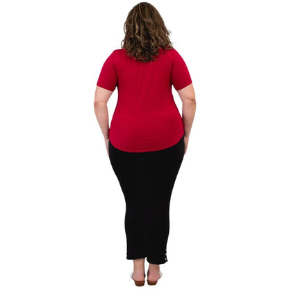 female model wearing lipstick red tessa tee and black nadine cropped pants back view on white background