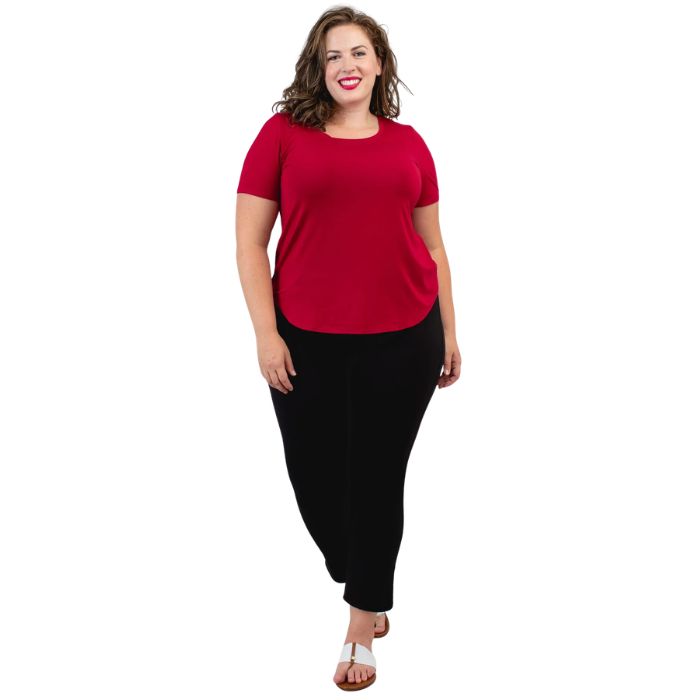 female model wearing lipstick red tessa tee and black nadine cropped pants front view on white background