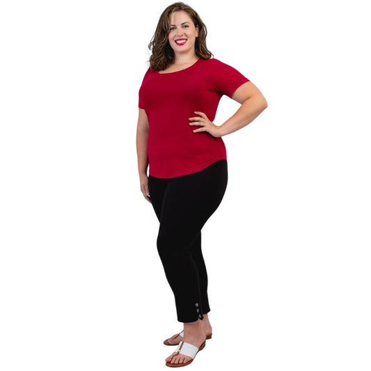 female model wearing lipstick red tessa tee and black nadine cropped pants side view on white background